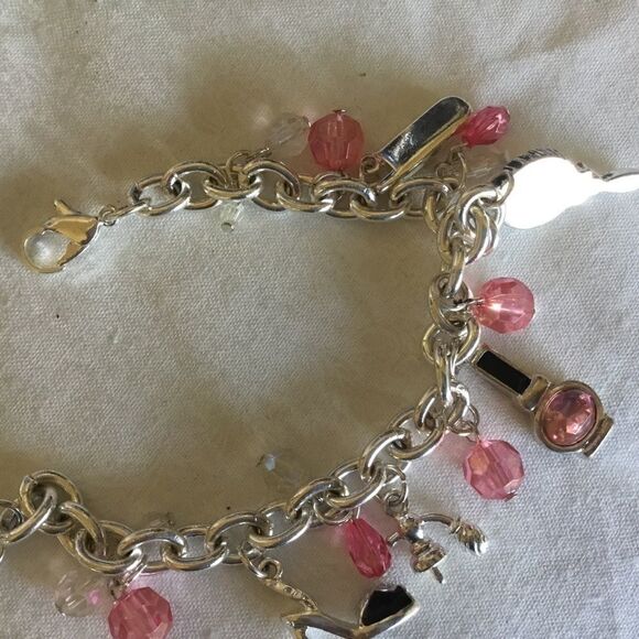 $12 ea of 3/$25. Silvertone “Girly” Charm Bracelet - Picture 7 of 7